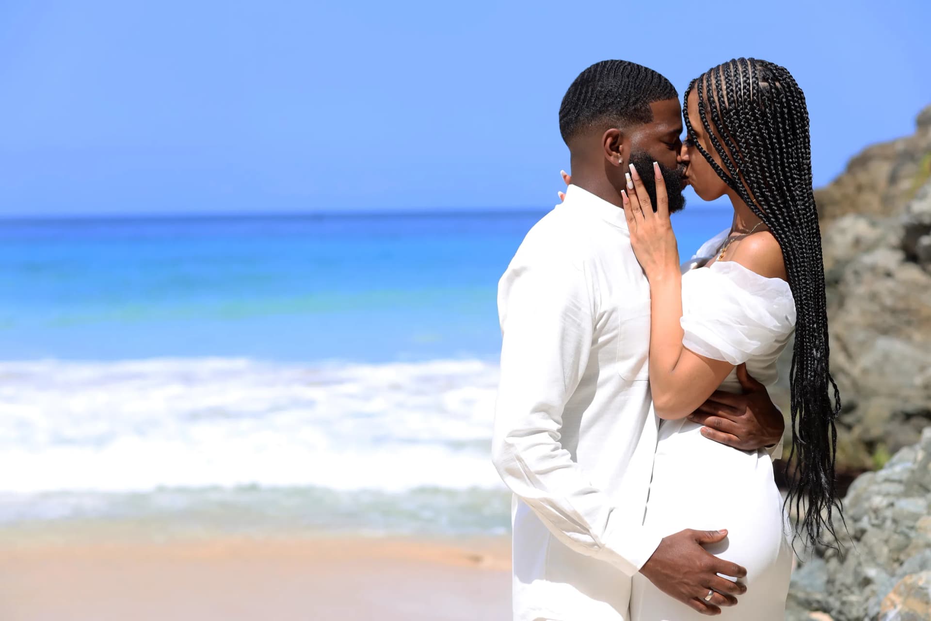 Couple embracing on Caribbean beach